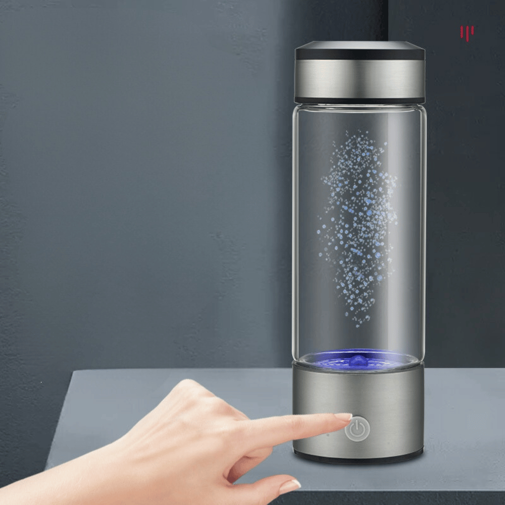 Close-up of a hand activating the Portable Hydrogen Water Generator with a touch button – easy one-touch operation feature.