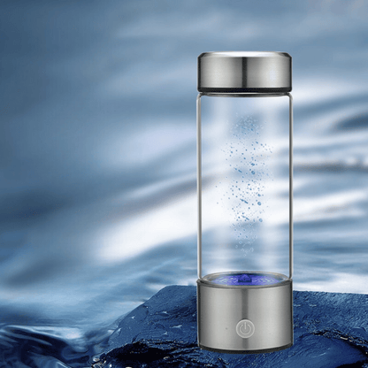 Hydrogen water bottle placed in calm water with blue light, symbolizing hydration and purity – waterproof design showcase.