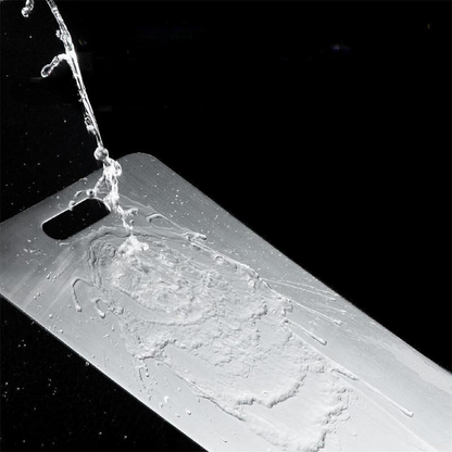 Water droplets on the surface of a Titanium Cutting Board, showing its water-resistant quality